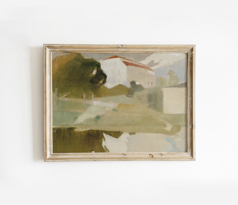 May include: A framed painting depicting a landscape scene with a house in the background. The painting is done in muted tones of green, brown, and white, with a hint of red on the roof of the house. The painting is framed in a simple, light wood frame.