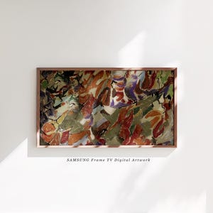 May include: Abstract digital artwork in a wooden frame. The artwork features a colourful composition of red, orange, green, and purple brushstrokes. The text "SAMSUNG Frame TV Digital Artwork" is at the bottom.