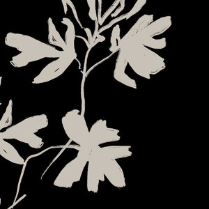 May include: A black and white illustration of a stylized floral design with delicate branches and leaves.