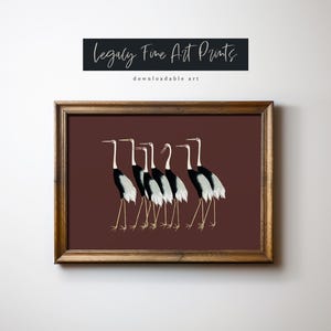May include: A framed print of a group of seven black and white cranes with red beaks standing in a line on a maroon background. The print is titled "Legally Fine Art Prints downloadable art".