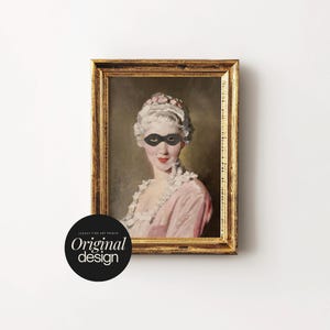 May include: A framed oil painting print depicting a person with powdered hair wearing a black eye mask and a pink garment with a white ruffled collar. The ornate gold frame surrounds the portrait, and a black circular logo reads Legacy Fine Art Prints Original design.