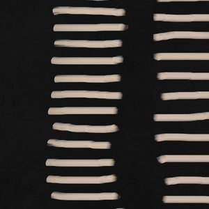 May include: Abstract art print with a black background and white lines. The lines are arranged in two vertical columns, with a gap between them.