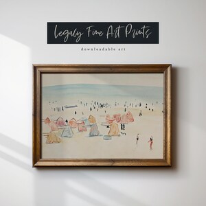May include: A framed watercolor painting of a beach scene with colorful beach umbrellas and people walking on the sand. The painting is titled "Legally Fine Art Prints" with the text "downloadable art" below the title.