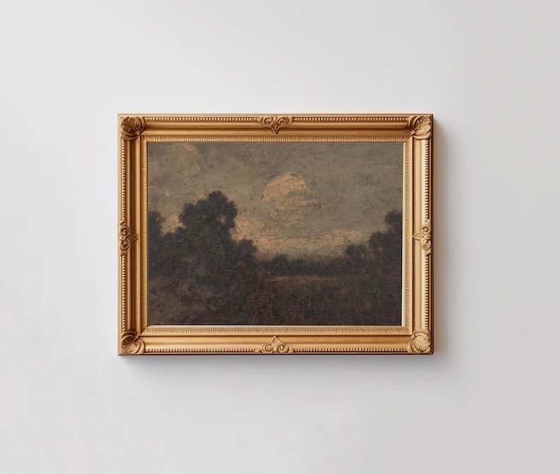 May include: A framed landscape painting depicting a dark, wooded scene with a cloudy sky. The painting is in a gold frame with ornate details.