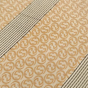 May include: A set of three ceramic mugs with a speckled, matte finish. The mugs are in shades of cream, light brown, and dark brown. Each mug has a simple, minimalist design, perfect for coffee or tea.