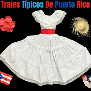 May include: A white traditional Puerto Rican dress with a red sash, lace trim, and a ruffled neckline. The image includes a straw hat, a red hibiscus flower, a Puerto Rican flag, and a fan with the Puerto Rican flag design. The text at the top says "Trajes Típicos De Puerto Rico."