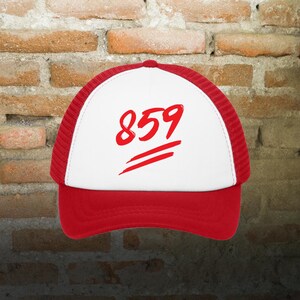 May include: A red and white trucker hat with the number "859" printed in red on the front.