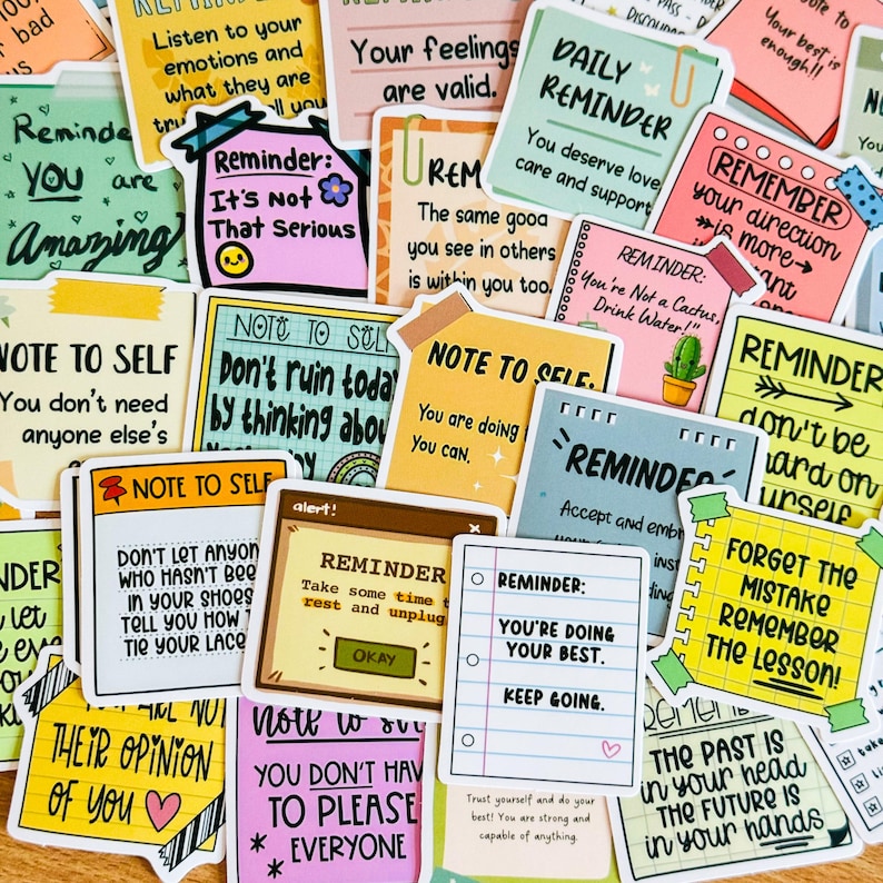 May include: A collection of colourful stickers with positive affirmations and reminders. The stickers feature various designs, including hand-drawn illustrations, text, and borders. Some of the messages include "You are amazing", "You deserve love", "Don't ruin today by thinking about yesterday", and "You're doing your best".