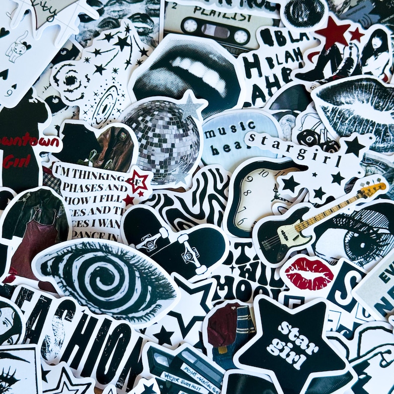 May include: A collection of black and white stickers with various designs, including a disco ball, a skateboard, a guitar, a clock, a star, a lips, an eye, and text that says "music beat" and "star girl".