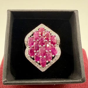 May include: A set of three ceramic mugs with a speckled, matte finish. Each mug features a different color: light blue, cream, and gray. The mugs have a simple, modern design with a rounded shape and a handle.