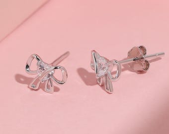 Kleine strikjesoorbellen, 925 sterling zilver en goud, elegante, delicate strikknopen met hartje en sprankelende diamant, schattig, flirterig sieraad, cadeau voor vrouwen