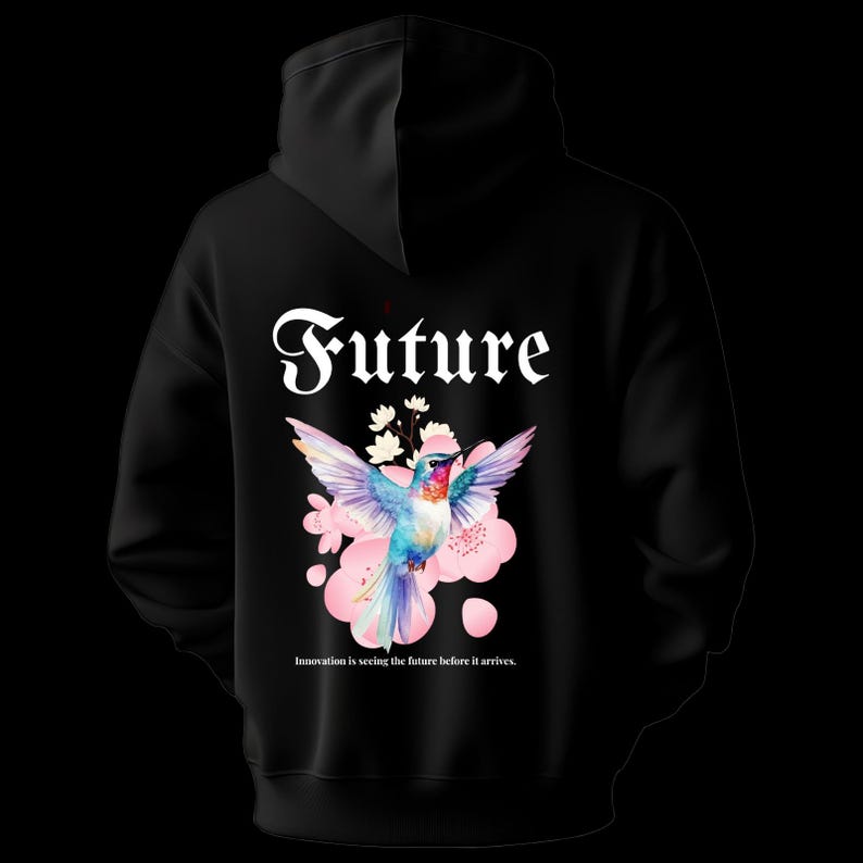 May include: Black hoodie with a colorful hummingbird graphic, pink flowers, and the word "Future" in white script. The text "Innovation is seeing the future before it arrives" is below the graphic.