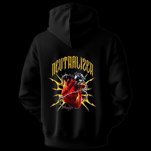 May include: Black hoodie featuring a graphic design on the back. The design includes a red heart pierced with barbed wire, a silver rose, and the word "NEUTRALIZER" in yellow, stylized text. The hoodie has a hood and a solid black color.