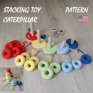 May include: A crochet stacking toy caterpillar pattern featuring a red head with the number five, followed by yellow, green, blue, and dark blue segments with numbers one through four. Includes matching rings and math symbol squares.