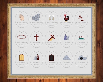 May include: A framed cross-stitch sampler with a gold frame, featuring 15 circular illustrations with religious themes. Each circle contains a small image and text, including words like "Prayer," "Friends," and "Justice."