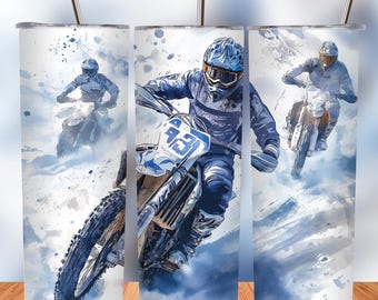 May include: Three stainless steel tumblers with a watercolor design of a motocross rider on a dirt bike. The rider is wearing a blue and white racing suit and helmet. The background is a blue and white watercolor wash.