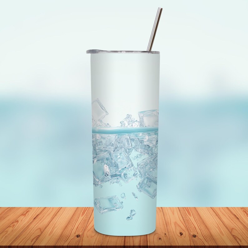 May include: A tall, cylindrical tumbler with a silver straw and lid. The tumbler is filled with ice cubes and water, creating a refreshing visual. The background is a soft blue gradient.