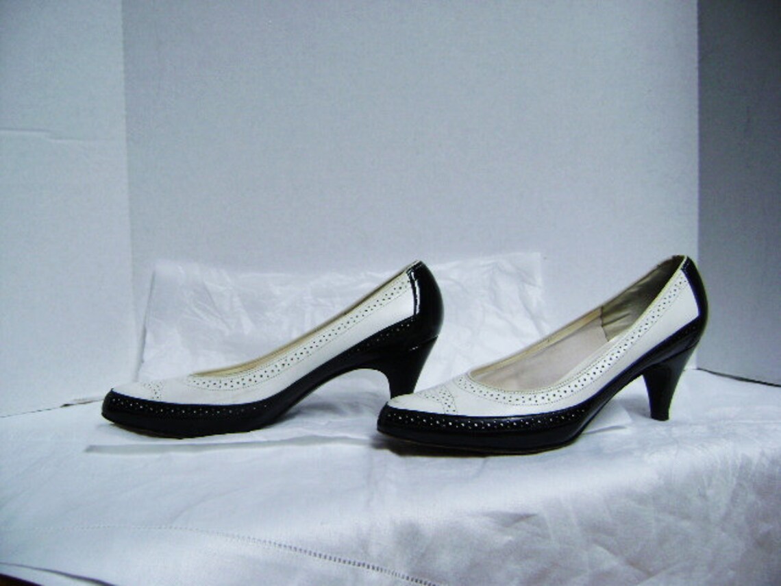 black and white wing tip heels