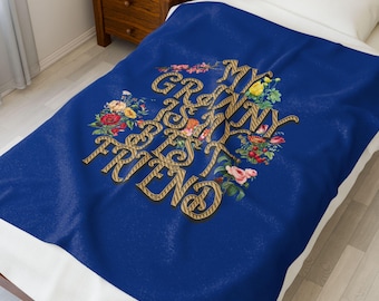 May include: Blue fleece throw blanket with a white border. The blanket features a floral design with the text "My Granny is my Best Friend" in a gold and black striped font.