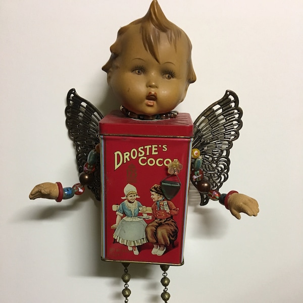 Assemblage  Doll, Hummel head and hands, Wings, Dutch Cocoa Tin