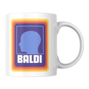 May include: White ceramic mug with a large handle. The mug features a retro design with a blue silhouette of a head inside a blue rectangle, with the word "BALDI" in white block letters.