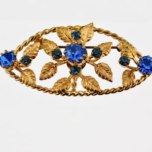 Vintage Gold tone Plating with Blue Rhinestones Floral Brooch.