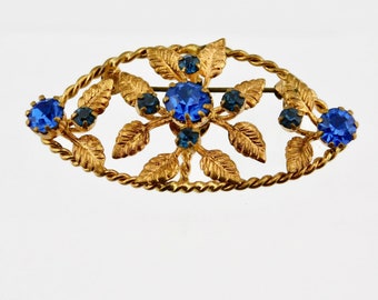 Vintage Gold tone Plating with Blue Rhinestones Floral Brooch.