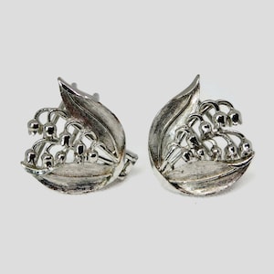Mimi Di N. Lily of The Valley Silver Tone Plating Belt Buckle.