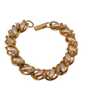 FLORENZA Gold tone and  White Faux Pearls Bracelet.