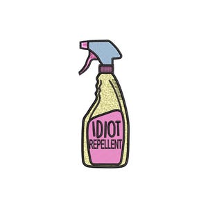 May include: A yellow spray bottle with a blue top and pink trigger. The bottle has a pink label with the words "IDIOT REPELLENT" in black text. The design is an embroidered patch.
