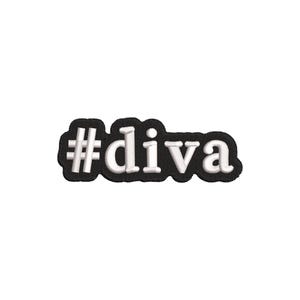 May include: A black embroidered patch featuring the white text #diva in a bold, sans-serif font. The embroidery has a raised, textured appearance with a thick black border that follows the contour of the letters, creating a distinct shape.