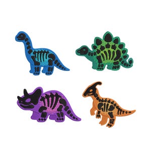 May include: Four embroidered dinosaur patches in blue, green, purple, and orange. Each patch features a black dinosaur skeleton design. Dinosaurs include a Brontosaurus, Stegosaurus, Triceratops, and Parasaurolophus.