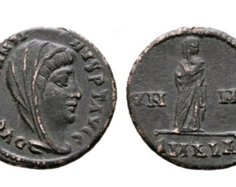 May include: Two sides of a dark, circular ancient bronze coin. The obverse features a profile portrait of a veiled figure with the inscription FL CONSTANTIA AVG. The reverse depicts a standing figure in robes with the inscription SMNE and LXXIX.