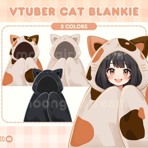 May include: A cute cat-themed blanket with a brown, white, and orange color scheme. The blanket features a cat face with large ears and a hood. The text "VTUBER CAT BLANKIE" and "3 COLORS" is displayed above the blanket.
