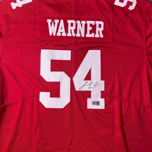 Koszulka z autografem Freda Warnera, zawodnika San Francisco 49ers, z certyfikatem autentyczności | Autentyczny autograf, idealny prezent dla fana