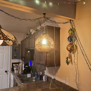 Mid Century Hanging Swag Lamp - Amber Swirl Design Glass Globe