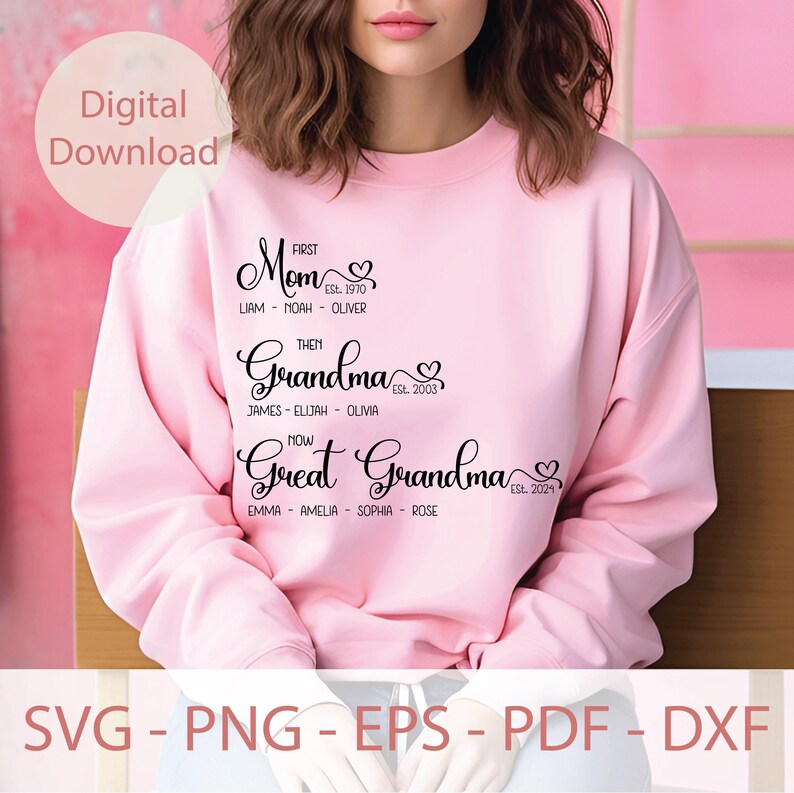 May include: A pink sweatshirt with black text that reads "First Mom Est. 1970 Liam - Noah - Oliver Then Grandma Est. 2003 James - Elijah - Olivia Now Great Grandma Est. 2024 Emma - Amelia - Sophia - Rose"