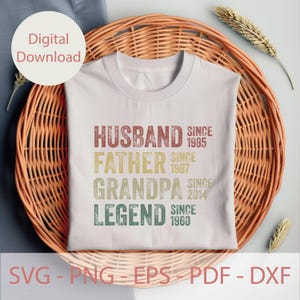 May include: A white t-shirt with the words "HUSBAND, FATHER, GRANDPA, LEGEND" in a vintage style font. The years 1985, 1987, 2014, and 1960 are printed next to each title. The words "Digital Download" are in a circle in the upper left corner.
