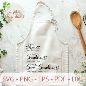 May include: White apron with black text that reads "First Mom Est. 1970 Liam - Noah - Oliver Then Grandma Est. 2003 James - Elijah - Olivia Now Great Grandma Est. 2024 Emma - Amelia - Sophia - Rose"