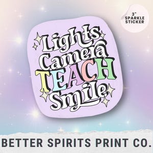 May include: A 3-inch sparkle sticker with a purple background and the text "Lights Camera Teach Smile" in a retro font. The text is in different colors, including yellow, pink, green, and white.