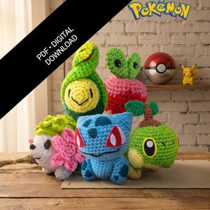 May include: A collection of handmade crochet Pokémon characters in various colors, including green, blue, pink, and yellow. The characters are displayed on a wooden surface with a brick background. A Poké Ball and Pikachu figurine are also visible.