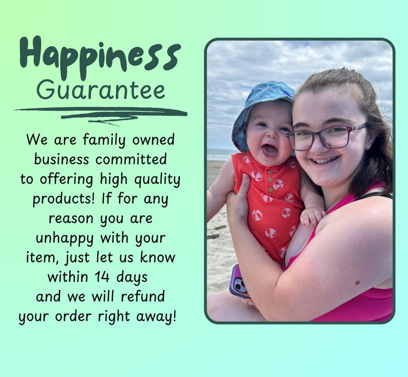 May include: A person and a baby smiling on a beach. The baby wears a red onesie and a blue hat. The person wears glasses and a pink top. Text on the left reads "Happiness Guarantee" and a refund promise within 14 days.