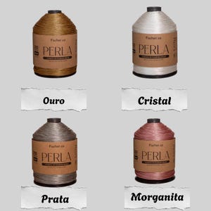 May include: Four spools of Perla polyester cord in gold, white, silver, and pink. Each spool features a brown paper label with the text Fischer.co, Perla, and cord&atilde;o de poli&eacute;ster brilho. The colors are labeled Ouro, Cristal, Prata, and Morganita.