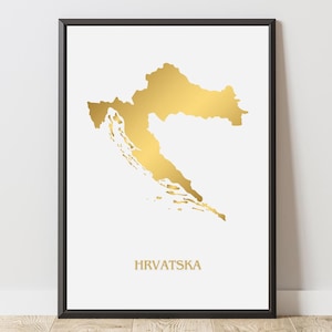 Może przedstawiać: Oprawiony wydruk przedstawiający złotą mapę Chorwacji na białym tle. Słowo "HRVATSKA" jest wydrukowane na złoto pod mapą. Wydruk jest oprawiony w czarną ramę.