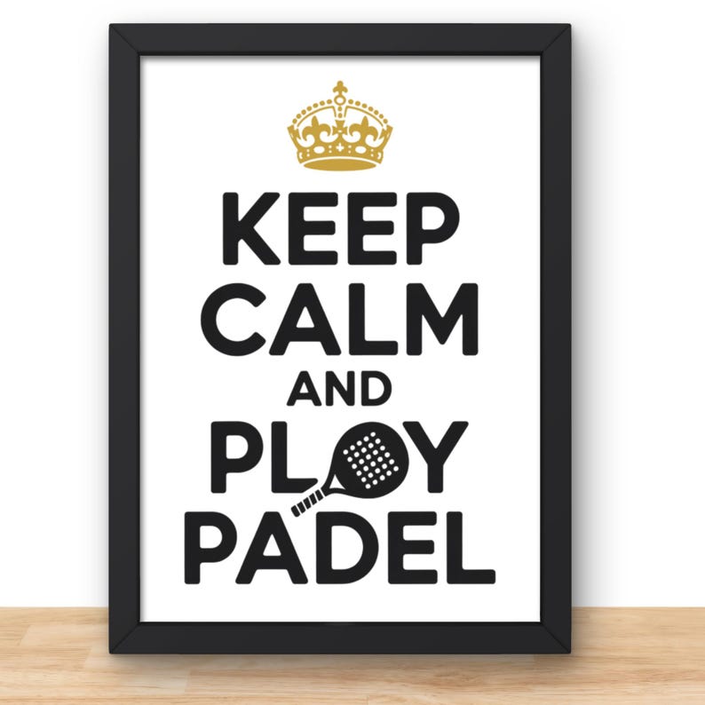 May include: A framed print with the words "KEEP CALM AND PLAY PADEL" in bold black letters. A gold crown is at the top, and a black padel racket graphic replaces the "O" in "PLAY". The frame is black.