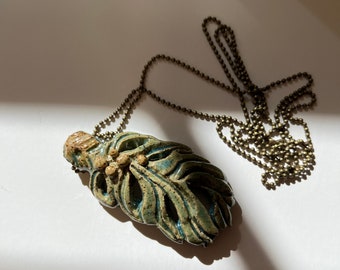 Hand made stoneware feather pendant on 30” ball chain