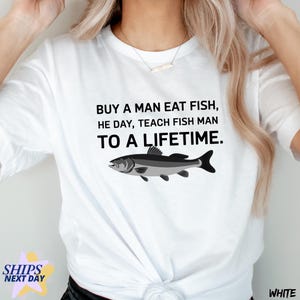 Funny Meme Shirt, Buy a Man Eat Fish He Day Teach Fish Man To A Lifetime, Live Weird Tee, Humorous Typographic Quote, Fishermen Gift T-Shirt