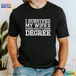 May include: Black t-shirt with white text that reads "I survived my wife's nurse practitioner degree."