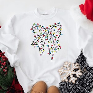 Christmas Lights Coquette Bow Sweatshirt, Merry Christmas Shirt, Christmas Lights Shirt, Xmas Party Sweatshirt, Cute Christmas Sweatshirt