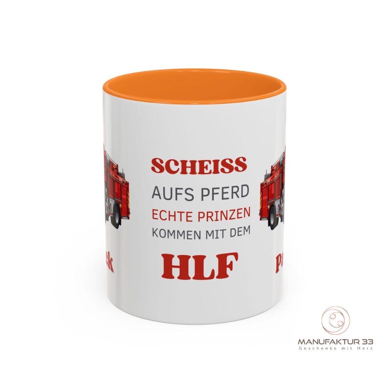 May include: White ceramic mug with an orange interior. The mug features red text and a red fire truck graphic. The text reads "SCHEISS AUFS PFERD ECHTE PRINZEN KOMMEN MIT DEM HLF".